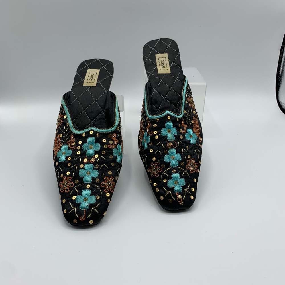 Toss embroidered mules.